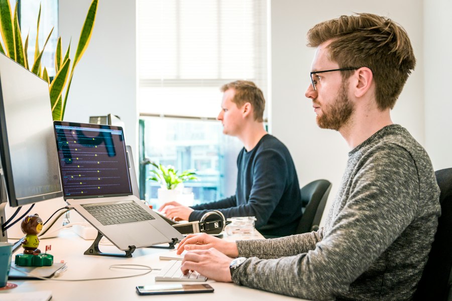 Developers reviewing work together in an office